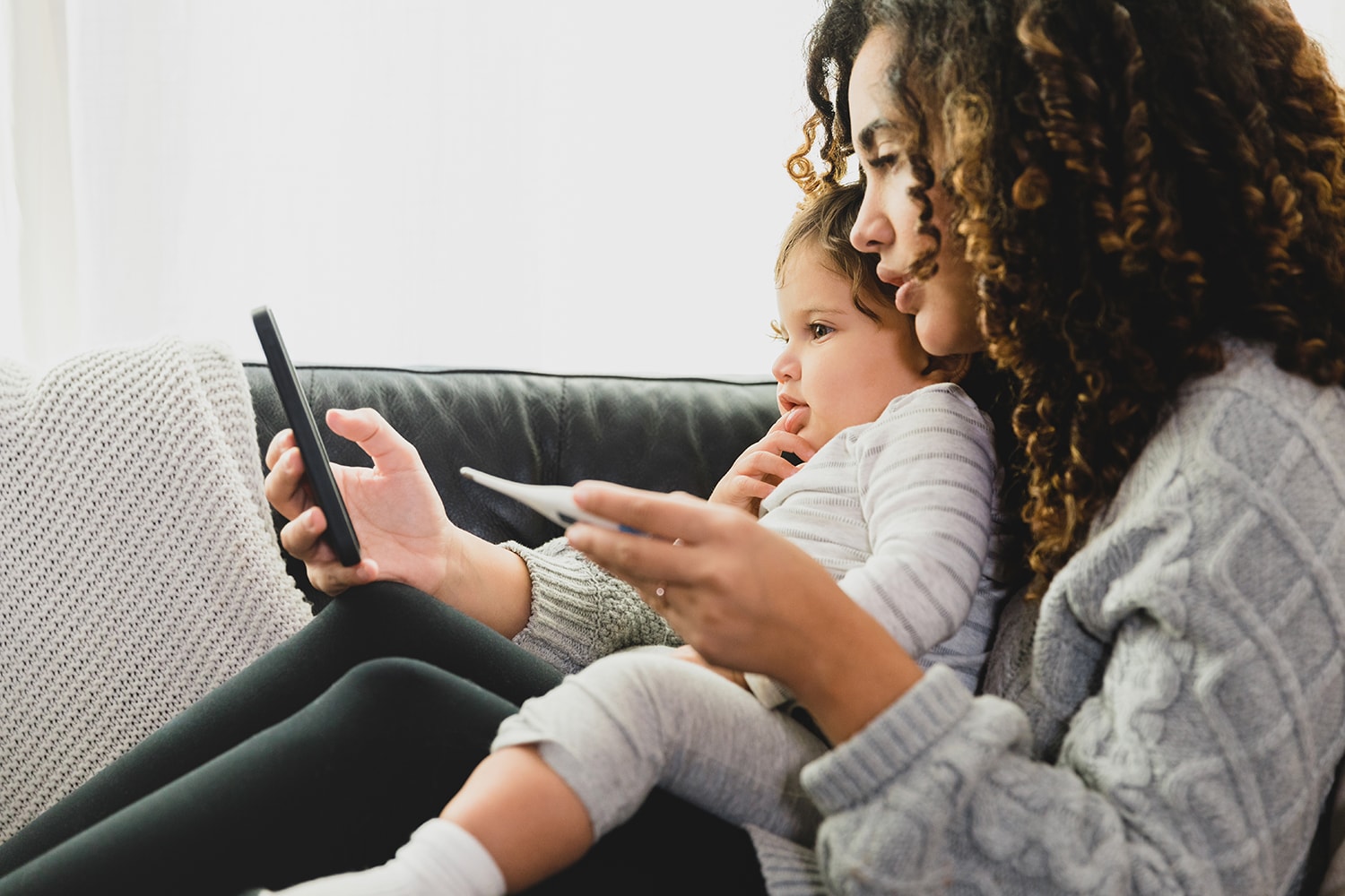 Mother and infant child using Agile Clinical Trials via their phone