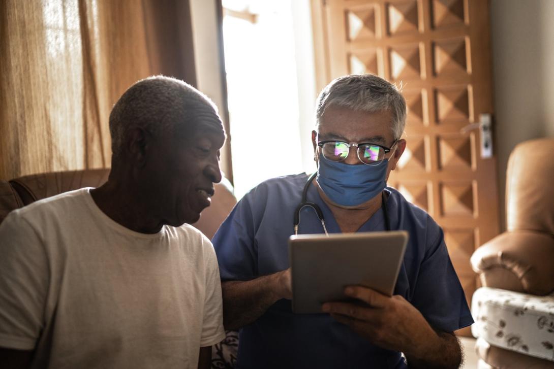 Health Care Worker and Patient Accessing Decentralized Clinical Trials